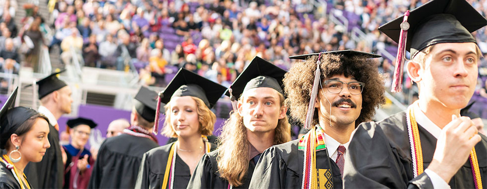 graduates in caps and gowns at commencement